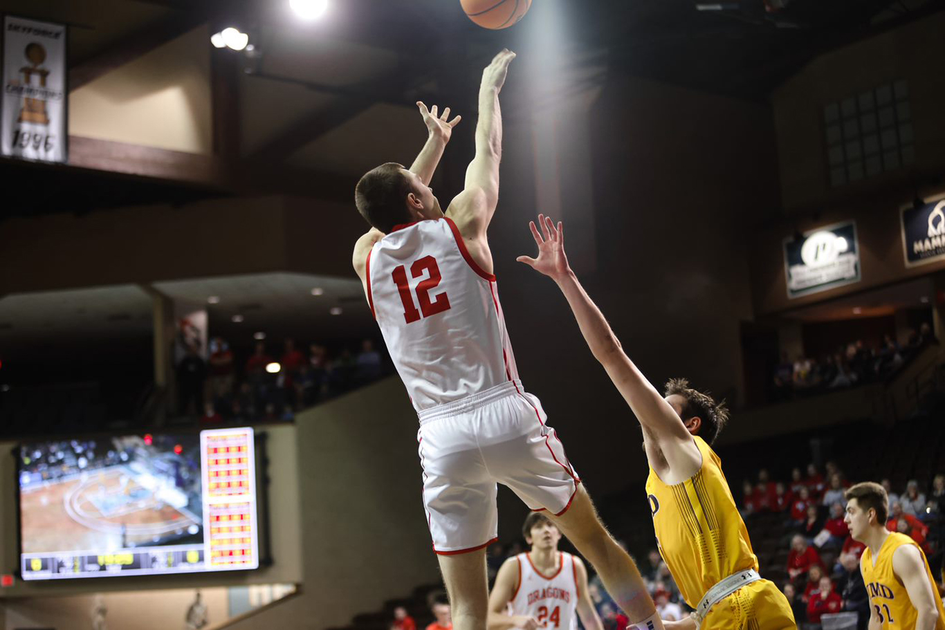 Gavin Baumgartner white uniform taking shot